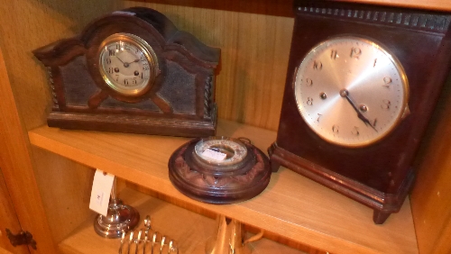 An eight day mantle clock in an oak case, a similar in mahogany case together with a barometer H 20