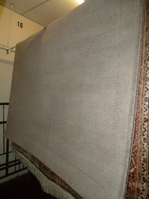 A contemporary rug the camel coloured field of stripe design 230cm x 160cm