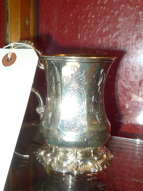 A Victorian hallmarked silver christening mug having scroll handle H 11 cm