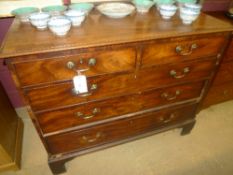 A mahogany chest of two drawers over three with brass handles