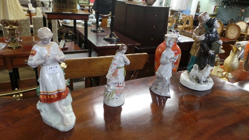 A set of four  porcelain Russian  figurines including courting couple