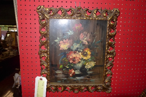 An oil on panel still life vase of flowers within gilt metal frame