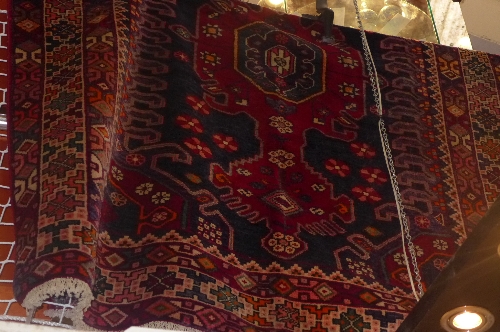 A fine North West Persian Malayer rug triple pole medallion within stylized geometrical motifs W