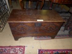 A late C17th oak coffer with later carved panel W 95 D 44 H 54 cm