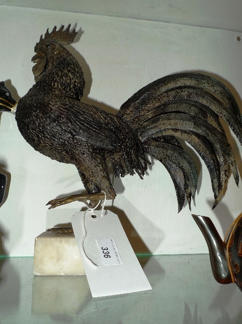 A metalwork sculpture of a cockeral on a marble base by Trevor Faulkner, signed to the base and