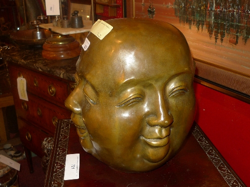 A Chinese bronze bust showing four expressions H 35 cm