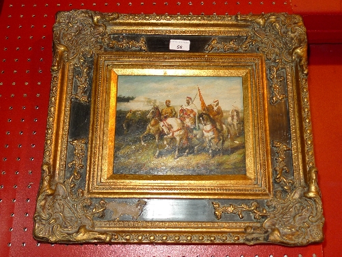 An oil on board Eastern Warriors on horseback in ebonised and gilt frame W 47 X L 44 cm