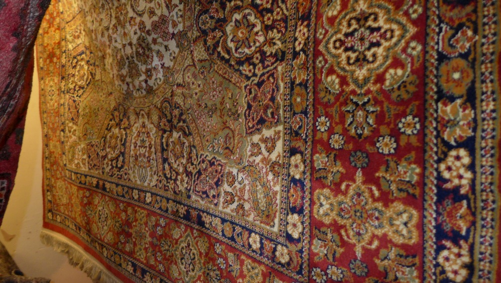 A Persian design Madras rug the multi coloured field with extensive foliate decoration 230 x 150 cm