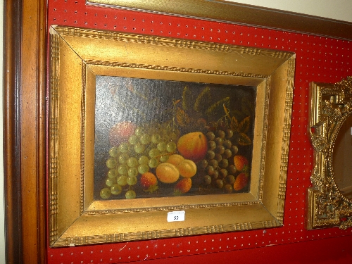 An oil, on board still life of fruit signed `Reynolds` in a gilt frame W 50 x H 40 cm