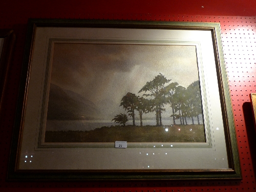 A framed and glazed watercolour stormy lake scene with trees in fore and hills in the distance   W