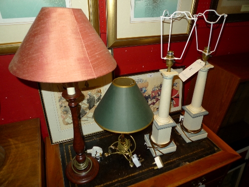 A pair of painted distressed table lamps. a brass similar together with a mahogany lamp both with