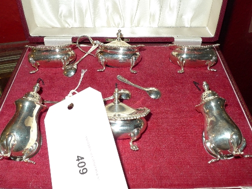 A case hallmarked silver Garrard & Co condiment set