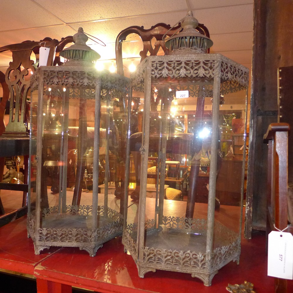 A pair of metal pagoda form hanging storm lanterns of large size   H 90 cm