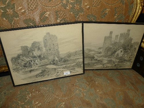 A pair of pencil drawings castle ruins with figures beside signed framed and glazed W 44 H 34 cm