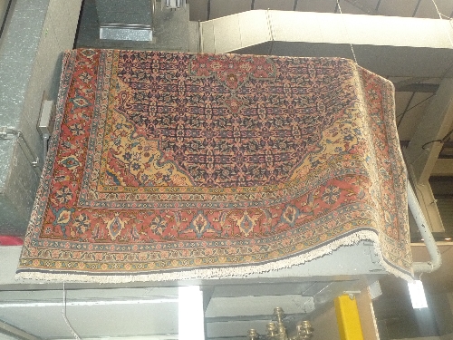 A fine North West Persian Sarouk carpet, pendant medallion with Palmette's on Indigo field framed by