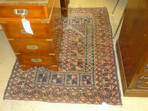 A hand knotted Persian style rug with central square decoration within multi border W 103 L 136 cm