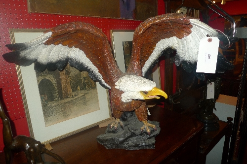 A painted model of an American eagle spreading its wings. 56 cm high.