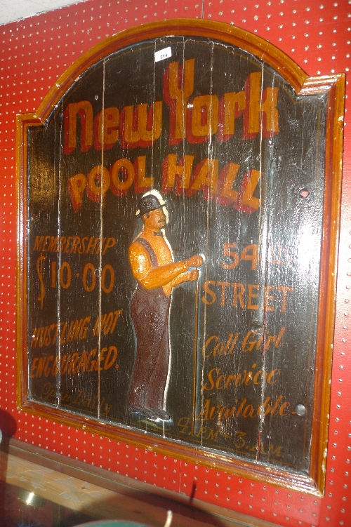 A carved and painted wooden sign for The New York Pool Hall (a/f)