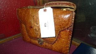 A  crocodile skin ladies handbag