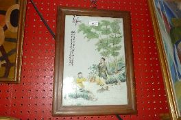 A Chinese style wall plaque with figures in traditional costume