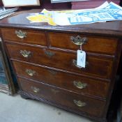 A C18th oak chest with two short above two three drawers on bracket feet