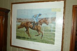 A signed print of a racehorse framed and glazed