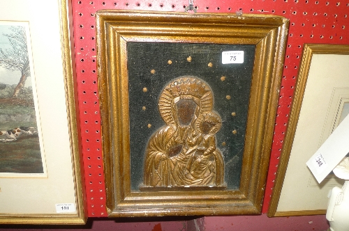 A framed wooden icon of Mary and Child on velvet background