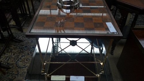 A chequered top low table on brass supports W 51cm