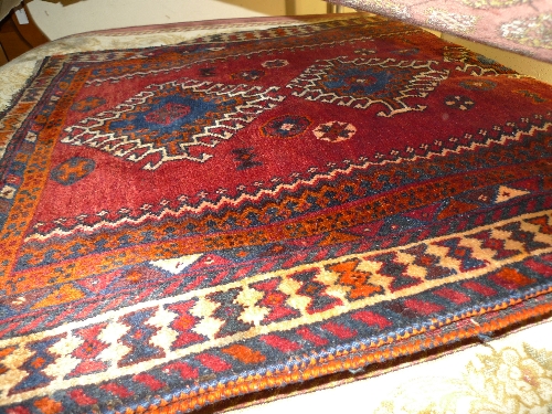 A fine old South West Persian Lori rug 193 cm x 105 cm repeating medallion on a terracotta field