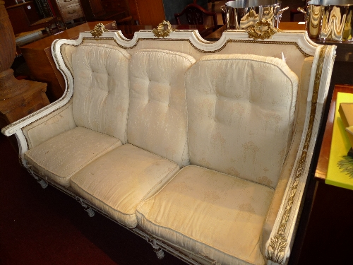A French design white painted and gilded three seater settee