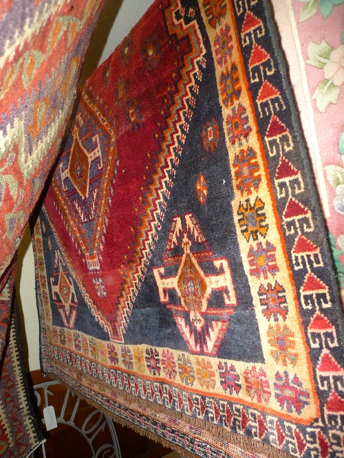 A fine South West Persian Qashgai rug 200 cm x 130 cm double diamond medallion on a terracotta