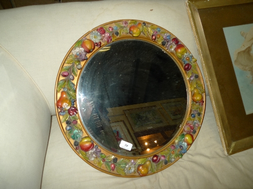 A Barbola type mirror floral border with circular bevelled plate