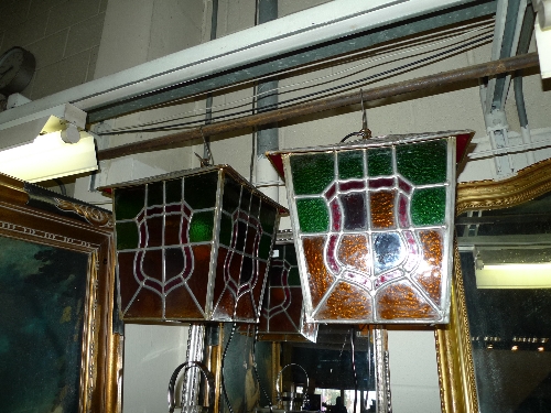 A pair of multi coloured leaded hall lanterns