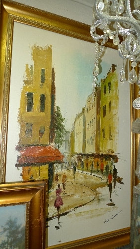 An oil on canvas Continental street scene signed within gilded frame