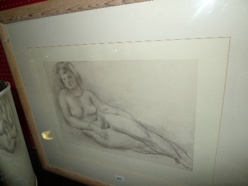 A framed and glazed print of a reclining voluptuous woman, signed Messina