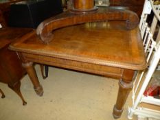 A Continental walnut and crossbanded centre table with plain frieze and ormolu mounts on turned