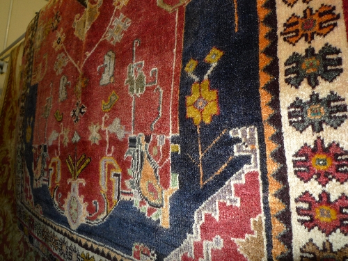 A fine South West Persian Qashgai rug 165 cm x 120 cm with pendant medallion on a terracotta field