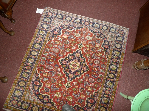 A fine North West Persian Bidjar rug 115 cm x 100 cm with central pendant medallion on a terracotta