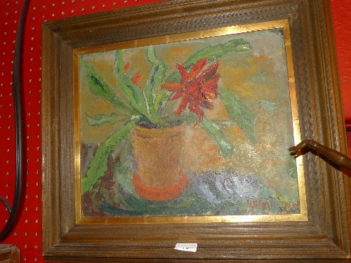 An oil on board still life of a red flower in a vase signed Helgin 1959