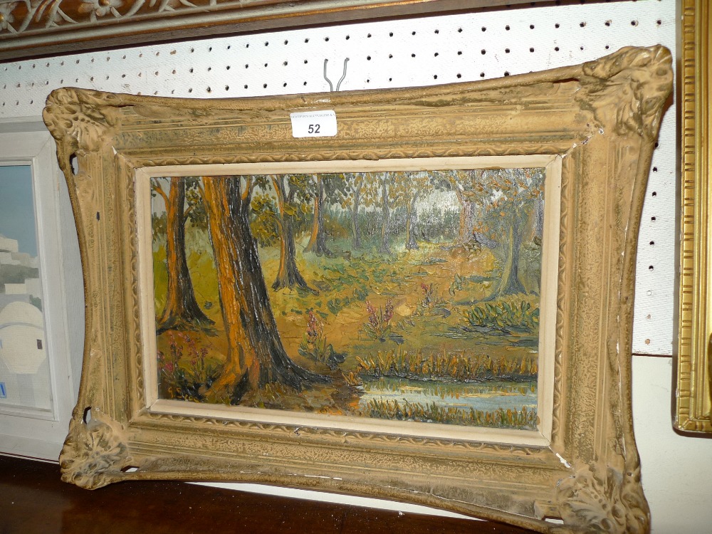 An Impressionist oil on board autumn woodland scene within giltwood frame