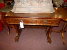 A William IV mahogany writing table fitted two drawers on stretchered supports