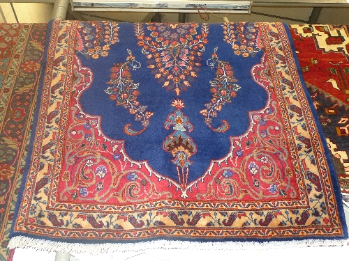 A fine North West Persian Tafresh rug 215cm x 145cm centre medallion on a rouge field within