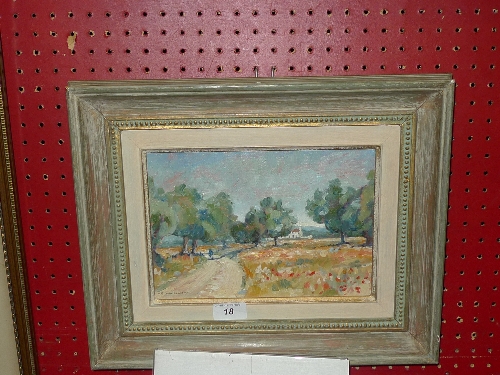 An oil on canvas country lane scene signed