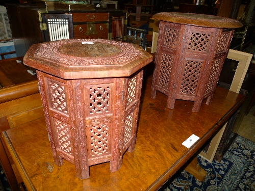 A pair of Moorish carved and brass inlaid folding tables
