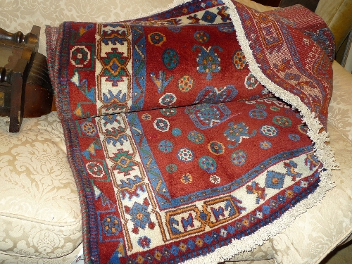A fine South West Persian Lori carpet, 240 cm x 160 cm, the wine coloured field of floral motifs in