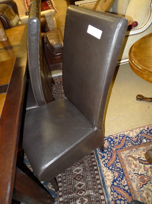 A set of six high back leather dining chairs