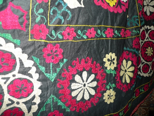 A fine Uzbekistan Suzanie wall hanging with repeating floral motifs 240cm x 175cm