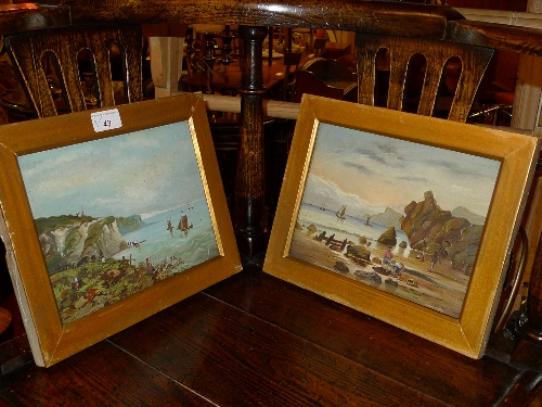 A pair of C19th oils on boards rocky coastal scenes in a gilt frames