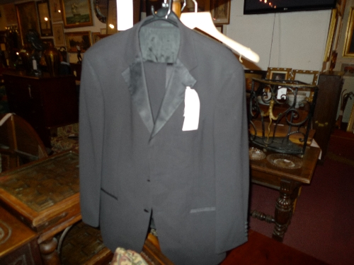 A Hugh Boss styled black tuxedo suit size 42 reg