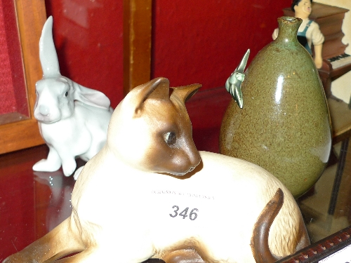 A Beswick model of a Siamese cat a green glaze pottery honey pot and a glazed model of a rabbit